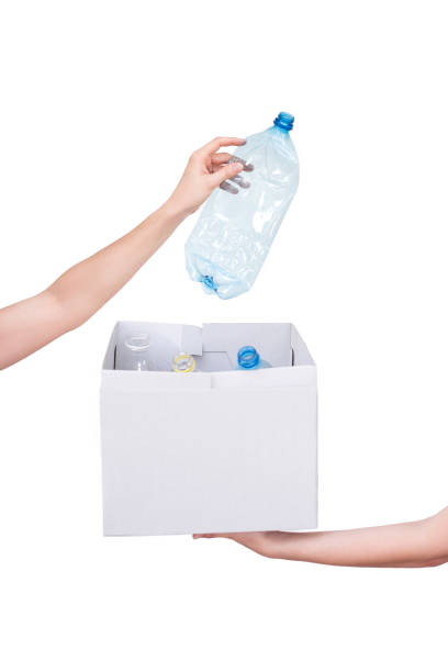 istock Female hands holding empty crushed blue plastic bottle isolated on white. Recyclable waste. Recycling, reuse, garbage disposal, resources, environment and ecology concept 1034152376