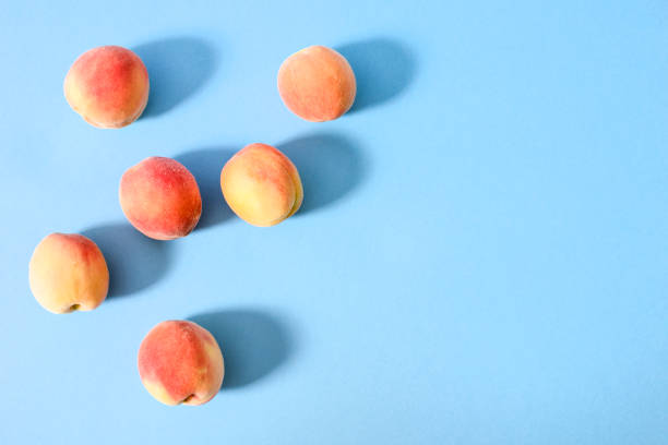 istock Whole ripe beautiful peaches with shadows 1034162850