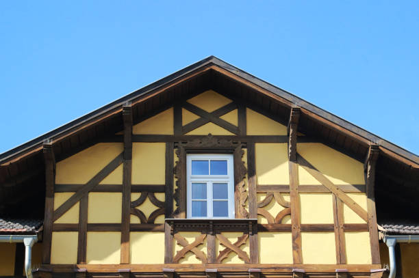 istock gable of a half-timbered house, blue sky 1034164130