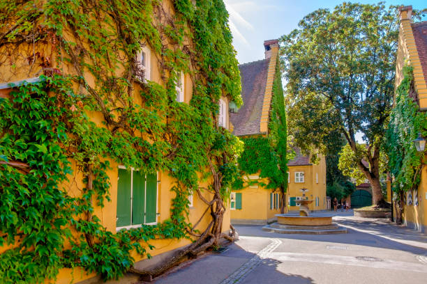 The Fuggerei is a housing complex in the Augsburg downtown, founded in 1516 as a place to host needy citizens. Augsburg is located on the famous Romantic Road (Romantische Straße), a \
