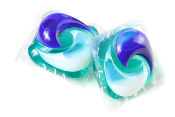 Washing detergent capsule pod isolated on white background Washing detergent capsule pod isolated on white background detergent capsule stock pictures, royalty-free photos & images