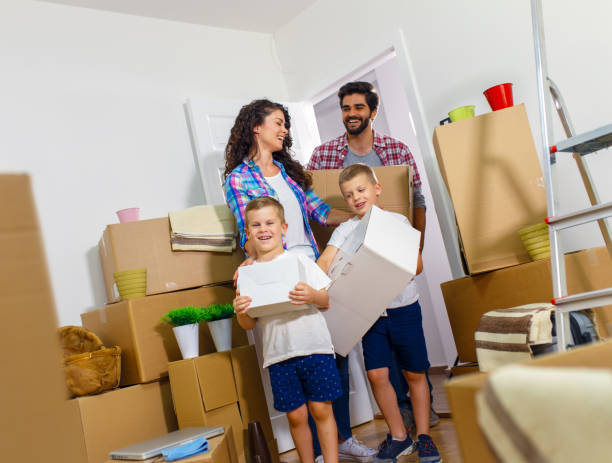 istock Happy young family having fun while moving into their new home. 1034183586