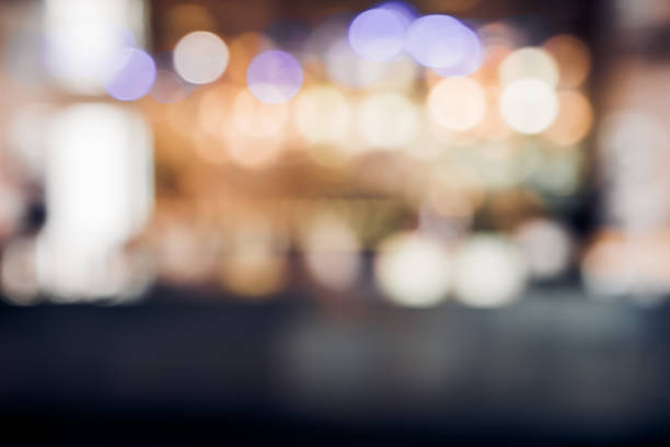 istock blur background of restuarant bar counter at night with bokeh light. 1034183732