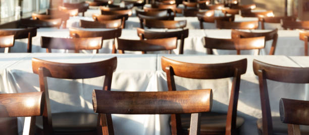 istock Wooden chairs in the restaurant background 1034183906