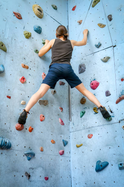 istock Teenage Boy Training Climbing On Indoor Climbing Wall 1034184620