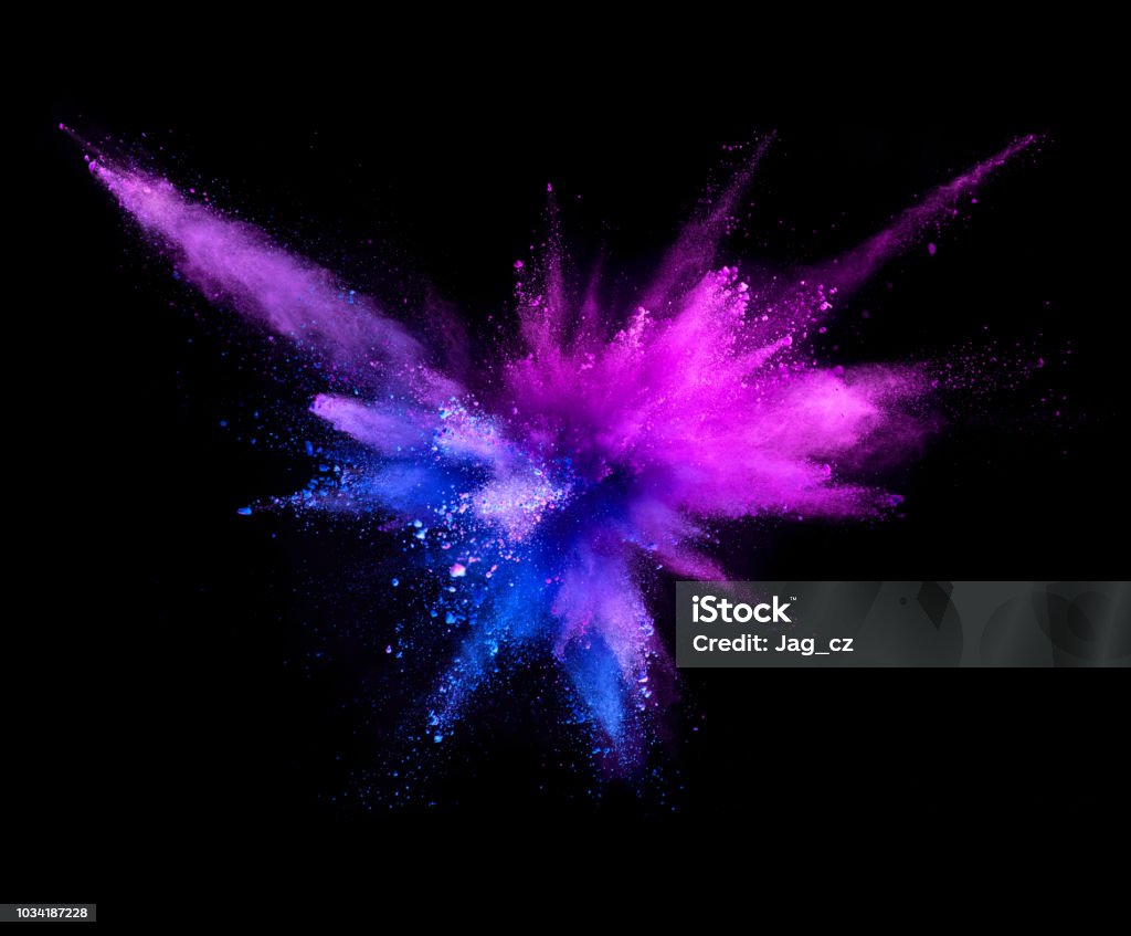 Explosion of coloured powder isolated on black background. Explosion of coloured powder isolated on black background. Abstract colored background Exploding Stock Photo