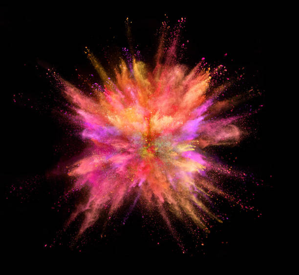 istock Explosion of coloured powder isolated on black background. 1034187270