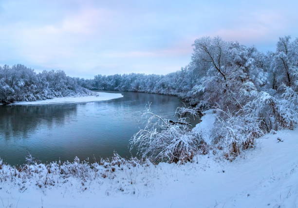 istock Snowfall on the river. The River Terek in the North Caucasus. 1034187340