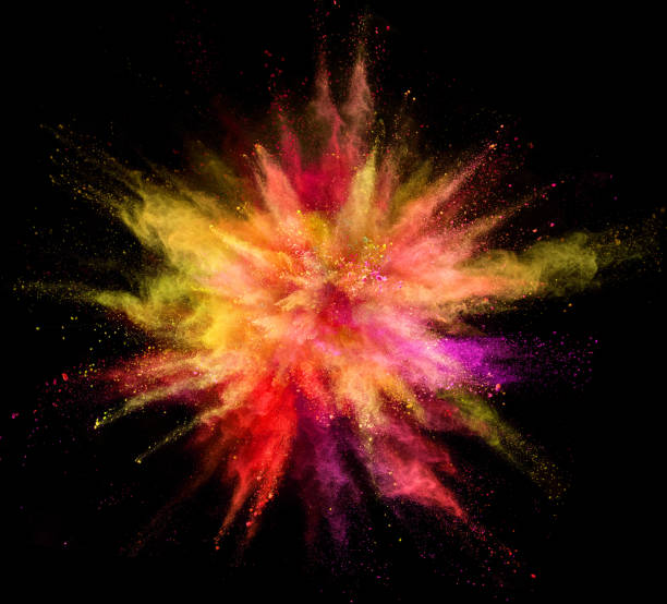 istock Explosion of coloured powder isolated on black background. 1034187366