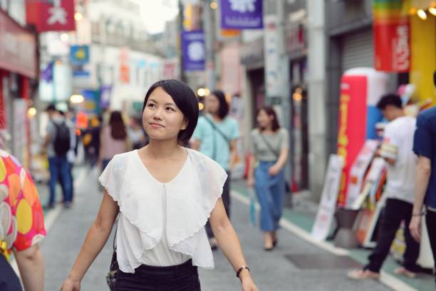 istock Young woman walking around a new area, exploring 1034187586
