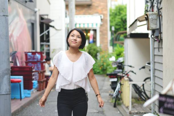 istock Young woman walking around a new area, exploring 1034187600