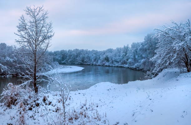 Snowfall on the river. The River Terek in the North Caucasus.