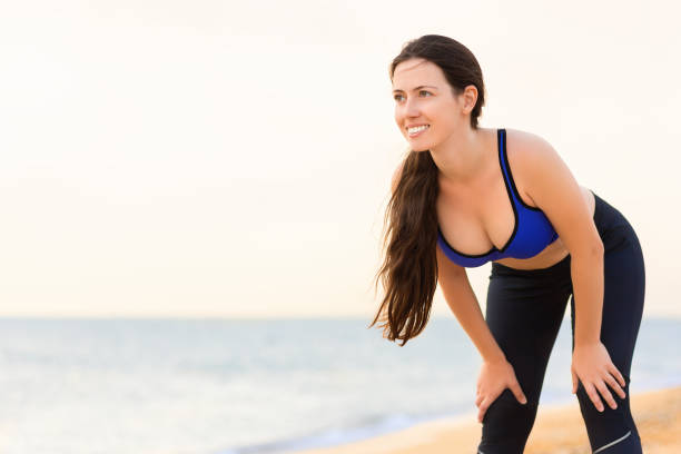 istock woman in sport bra after run 1034187762
