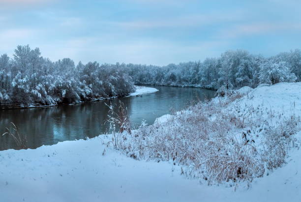 istock Snowfall on the river. The River Terek in the North Caucasus. 1034191950