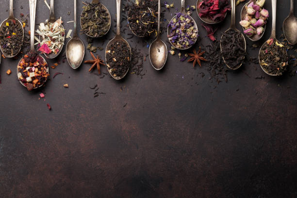 istock Various tea in spoons. Black, green and red tea 1034195106