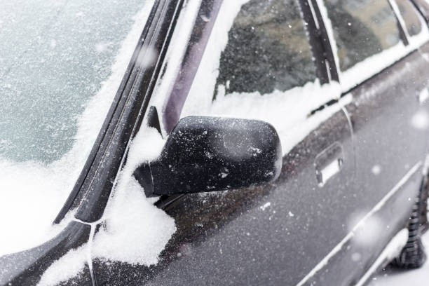 istock Car covered with fresh white snow. 1034195744
