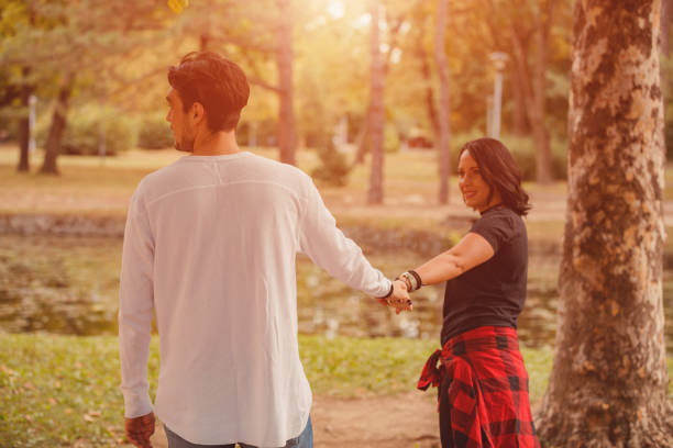 istock Couple in love holding hands. 1034198232