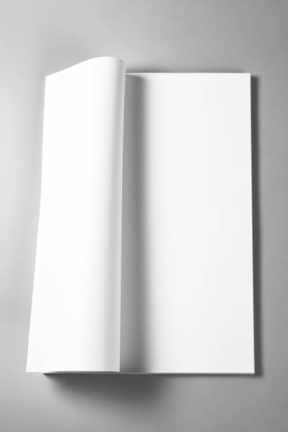 istock Blank open book or magazine with curled upper page 1034202066