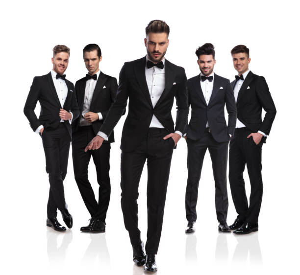 istock sexy groom leader walking in front and snapping fingers 1034207608