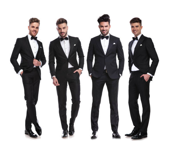 istock elegant group of four men standing with hands in pockets 1034207632