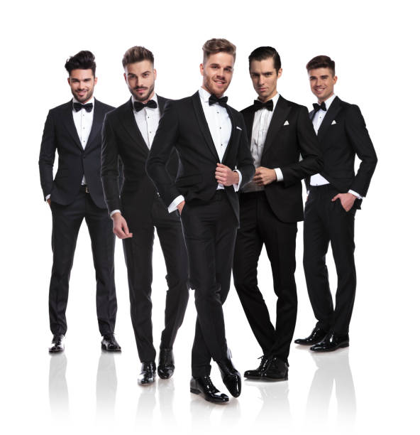 istock team of five groomsmen standing with leader in front 1034207682
