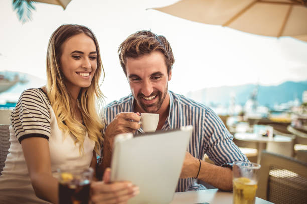 istock Happy couple checking menu at the tablet 1034208336