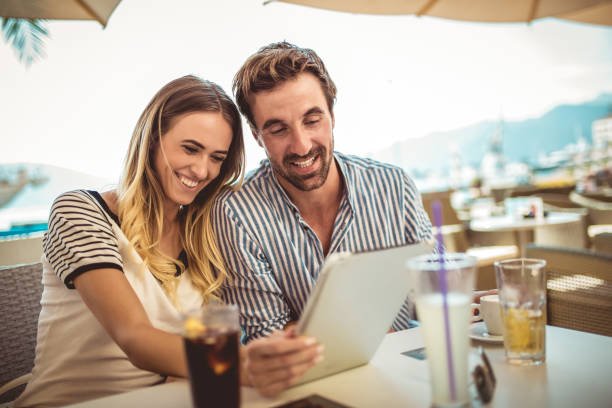 istock Happy couple checking menu at the tablet 1034211394