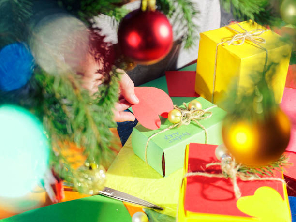 istock Wrapping Christmas presents under the Christmas tree 1034212032