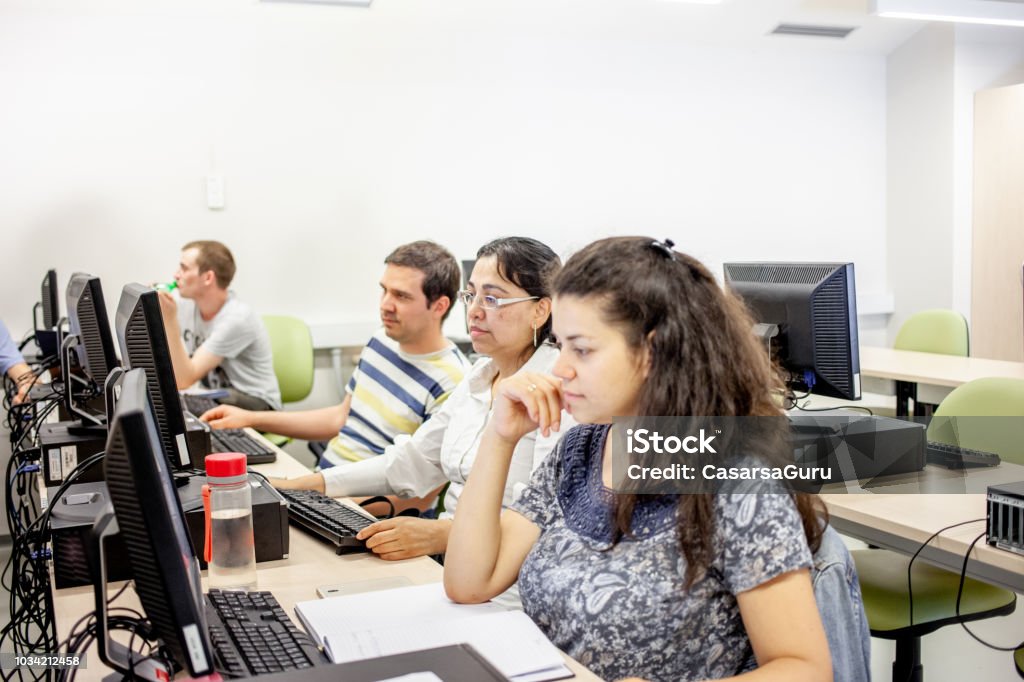 Adult Student Using Computer Adult Female Students Using Computer In Computer Classroom Stock Photo ...
