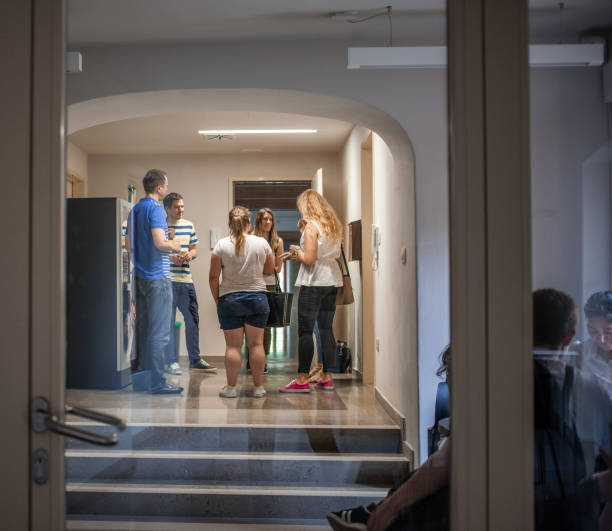 istock Group of Adult Students Socializing in University 1034212540