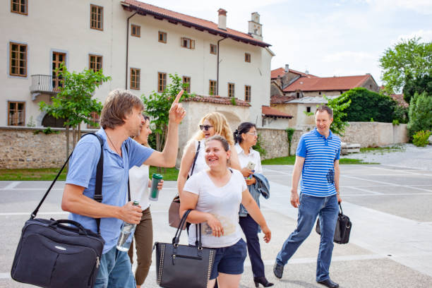 istock Group of Adult Students Walking on University Front Yard 1034212594