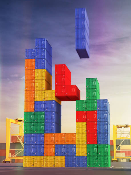 Block stacking stacking real life Container Game. A big stack of shipping containers in port arranged as a block stacking game. block stacking video game stock pictures, royalty-free photos & images