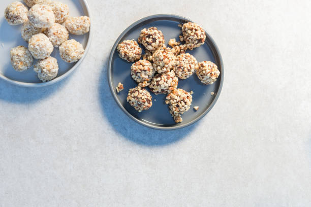 Gluten Free Vegan Truffles, tasty protein packed snacks Gluten Free Vegan Truffles, such as Chocolate Cherry Almond Bites and Coconut Cashew Crunch Bites plasma ball stock pictures, royalty-free photos & images