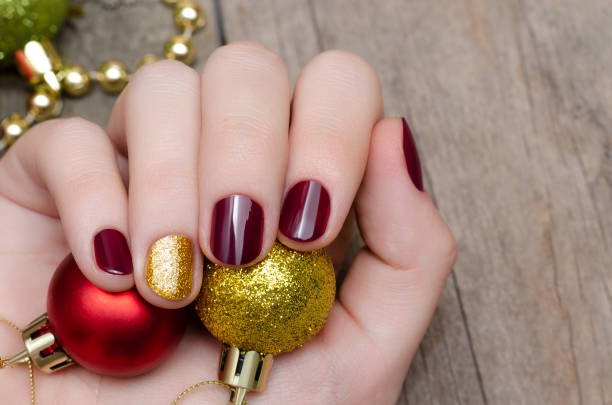 istock Beautiful female hand with christmas nail design 1034224734