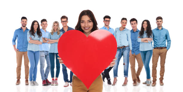 istock young woman celebrating valentine's day with her casual group 1034224872