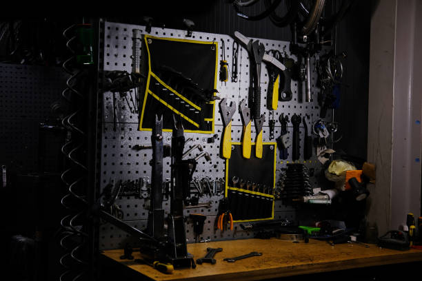 istock Bicycle tools on a wall. Bike mechanic garage with workshop tools wall. Repair concept 1034228988