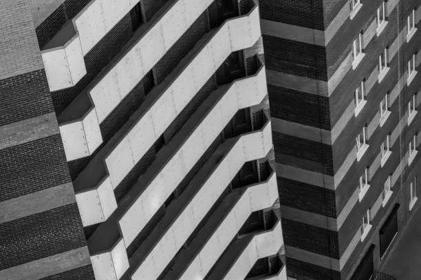 istock White balconies on a brick building, black and white 1034233190