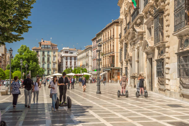 People on the Plaza Nueva (Plaza de Santa Ana) in the old quarters of Granada, Spain