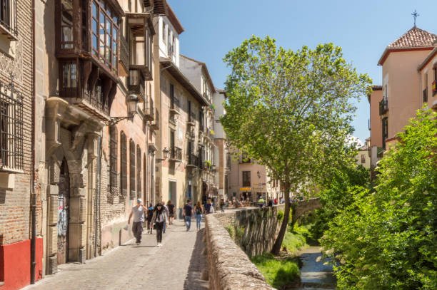 Old houses (facade) along the Carrera del Darro in the historic centre of Granada, Spain