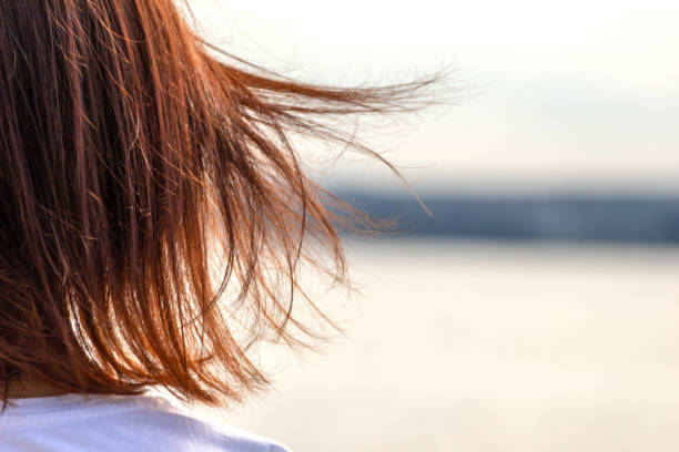 istock Developing hair in the wind against the sea 1034244562