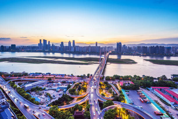 istock The light trails on the modern building background in shanghai china. 1034245752