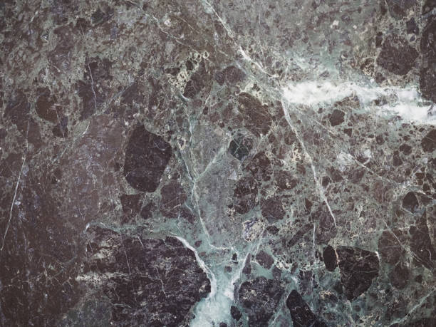 istock glossy green and black marble texture background 1034249450