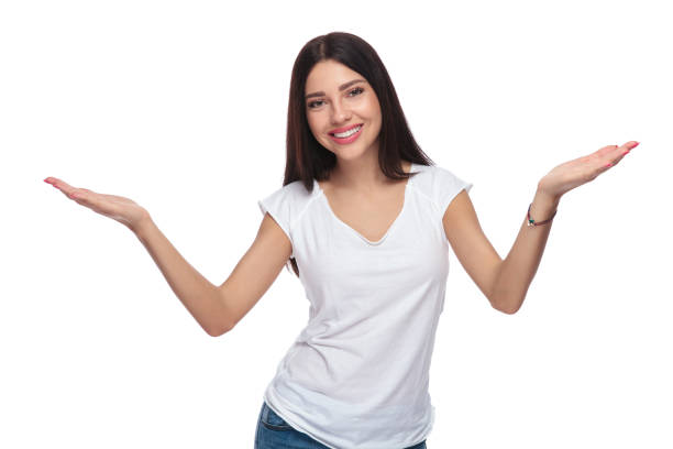 istock portrait of smiling woman making an inviting gesture 1034249582
