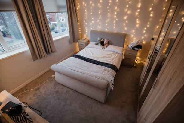 Empty Student Flat Bedroom Empy student bedroom decorated with twinkle lights and teddy bears. dorm room photos stock pictures, royalty-free photos & images