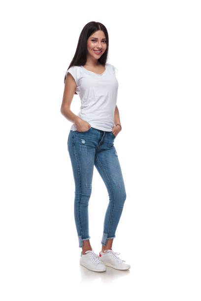 istock relaxed casual girl standing with hands in pockets 1034249852