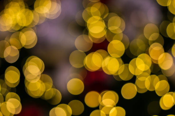 istock Defocused lights of golden Christmas tree 1034249952