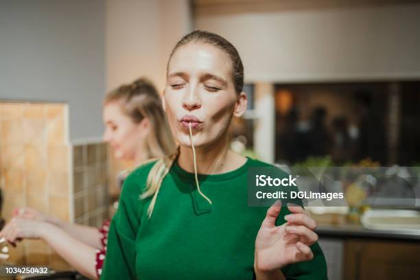 Spaghetti Fun At A Dinner Party Stock Photo - Download Image Now - Eating, Food, Pasta