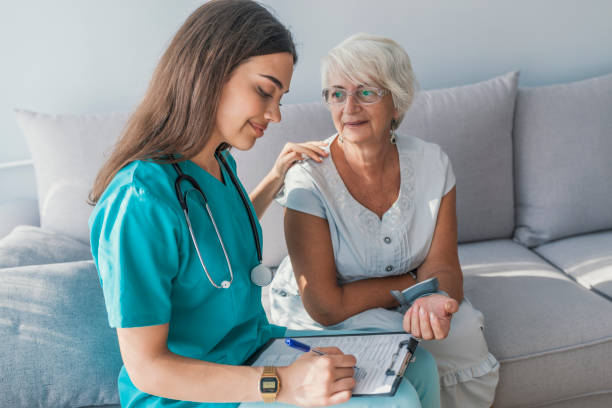 istock Doctor checking elderly woman's blood pressure 1034254286