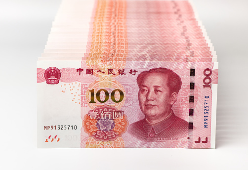 istock Row of Chinese yuan banknotes close up. 1034256338