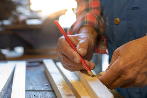 istock Man measuring a piece of wood 1034264642